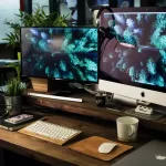 Workspace with computer, keyboard, and mouse for person to make $14,000 a year.