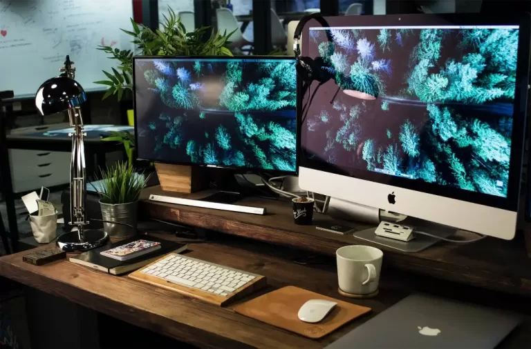 Workspace with computer, keyboard, and mouse for person to make $14,000 a year.
