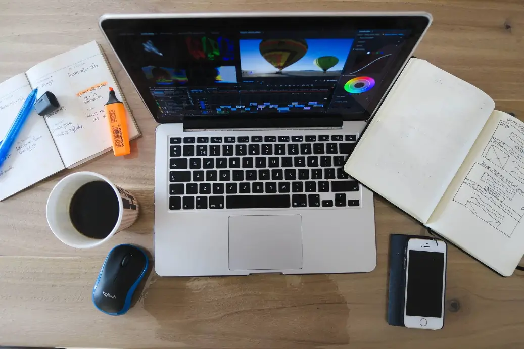 Computer and book workspace for person to make $25,000 a year.