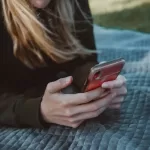 Person with a phone making $74,000 a year.