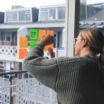 Women with glasses working and earning $89,000 a year.